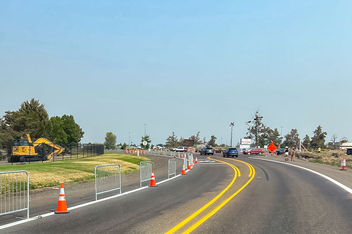 The temporary pedestrian walkway along SW Yew Ave/SW Airport Way.